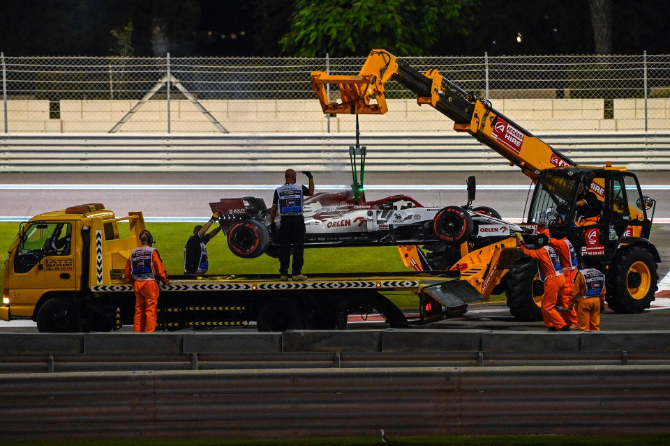 Raikkonen's car was taken away on a tow truck after the fire was put out