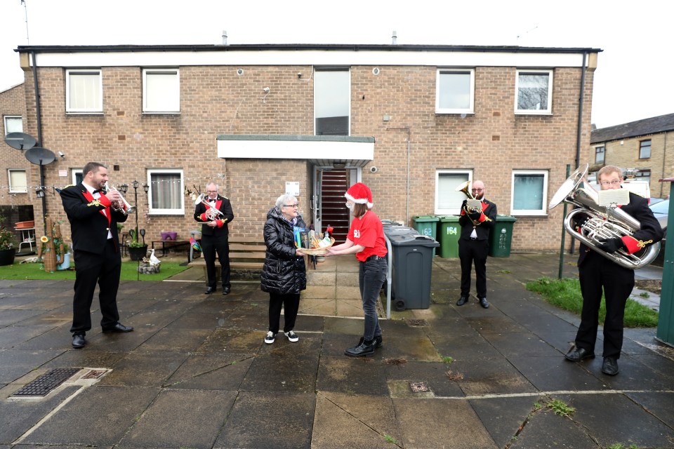 Sandra Yates was serenaded by a festive brass band as she received her goodies