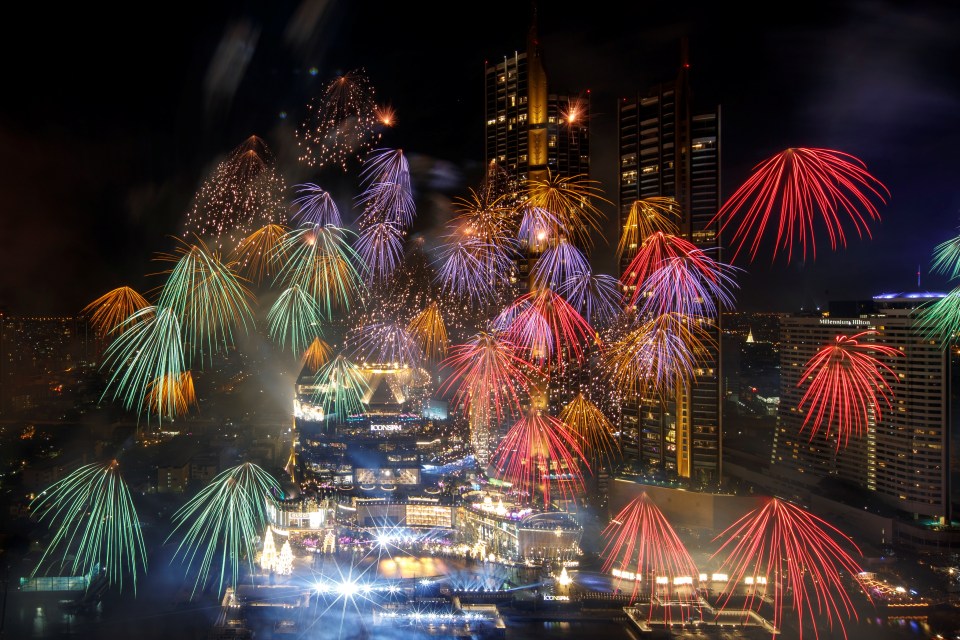 Fireworks exploding over the Chao Phraya River in Thailand
