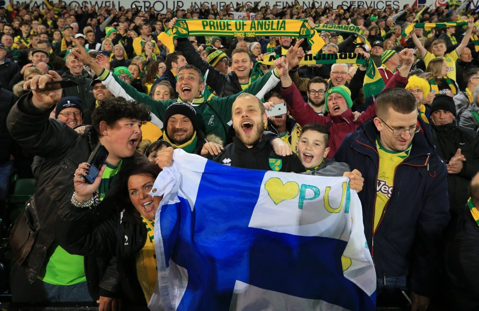 The Finnish star celebrates with Norwich fans after clinching promotion