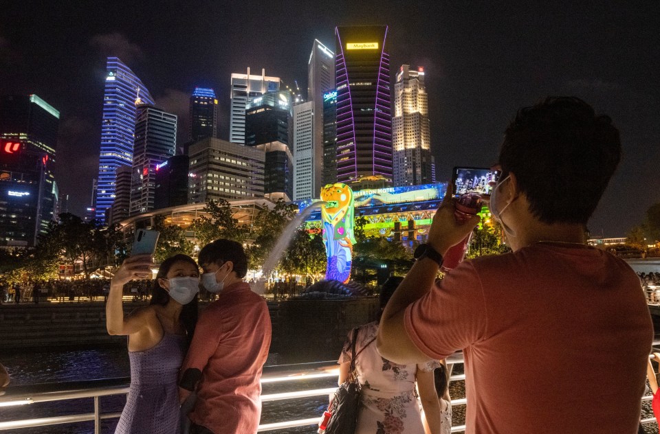 Singapore's Marina Bay hosted a light show as people watched on from the ground 