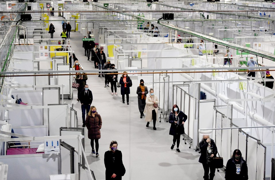NHS staff wait with key workers to get their Covid jabs in Glasgow