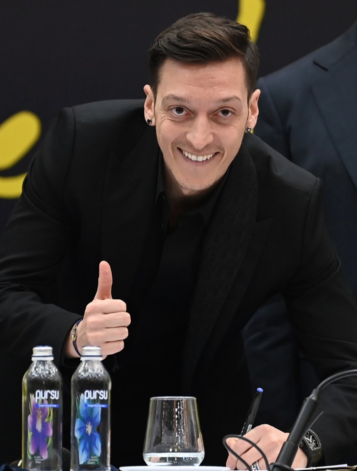 Ozil grinned from ear to ear after officially signing for boyhood club Fenerbahce