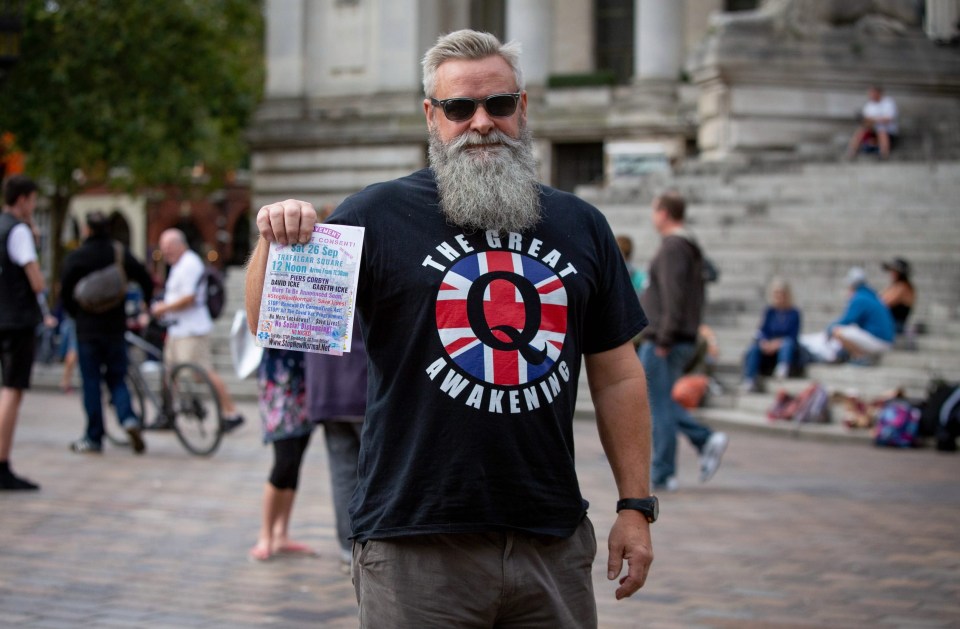 A protester with a QAnon conspiracy theory T-shirt as anti-lockdown demonstrators who gathered to listen to Piers Corbyn
