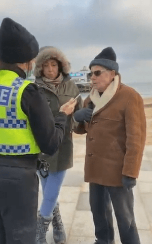 Officers also approached another woman and a man on the same seafront in the staged video