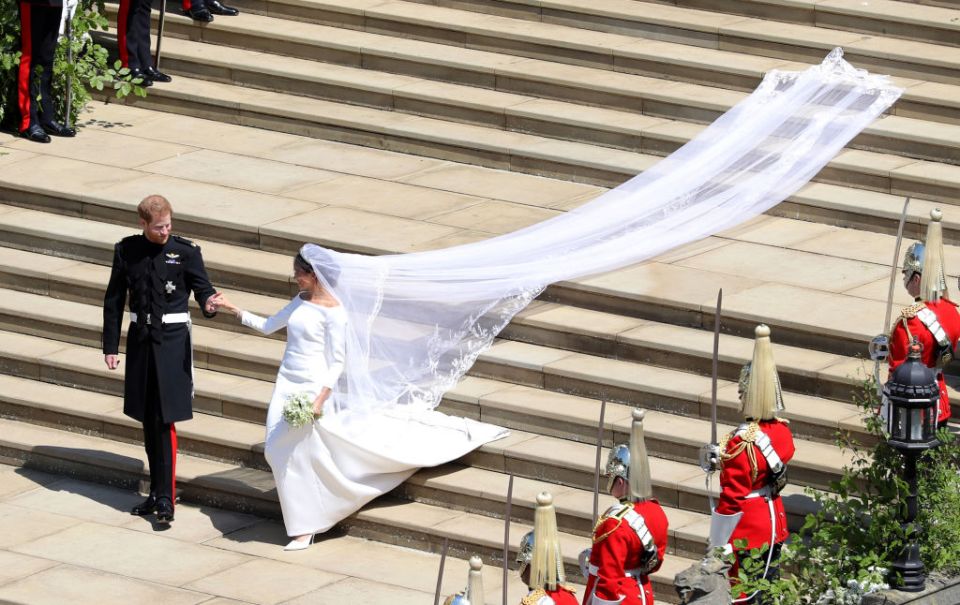 Her dress had a 16ft train and veil which was adorned with the flowers of the 53 commonwealth countries