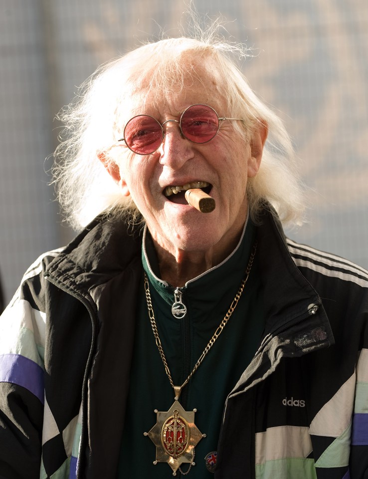 QAnon believers in Britain use Jimmy Savile as evidence of a 'global Satanic childeating cabal' that runs the world