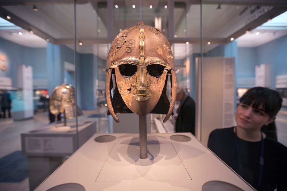 A woman views the Sutton Hoo helmet in the British Museum, London