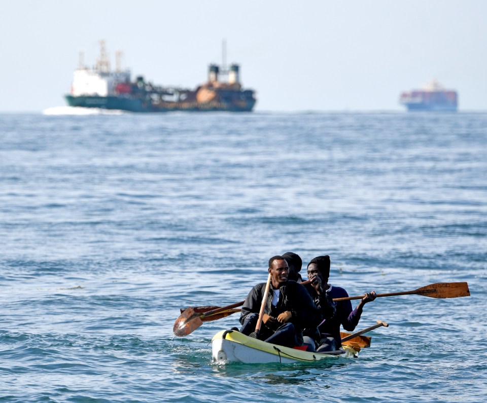 Group of migrants crossing the Channel in a kayak