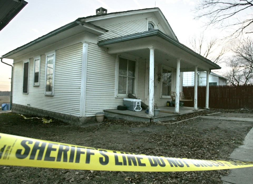 Police tape at the home of Bobbie Jo Stinnett in Skidmore, Missouri, where she was horrifically murdered