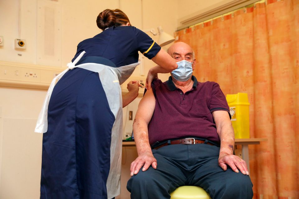 Brian Pinker receives the Oxford University/AstraZeneca vaccine at the Churchill Hospital in Oxford