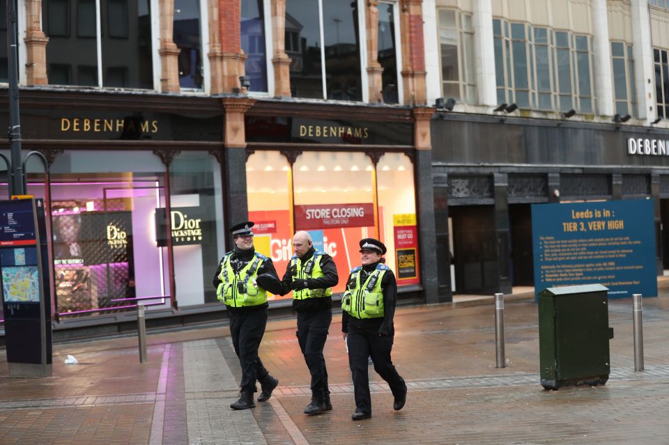 Police Community Support Officers (PCSOs) patrol along Briggate in the city centre of Leeds yesterday