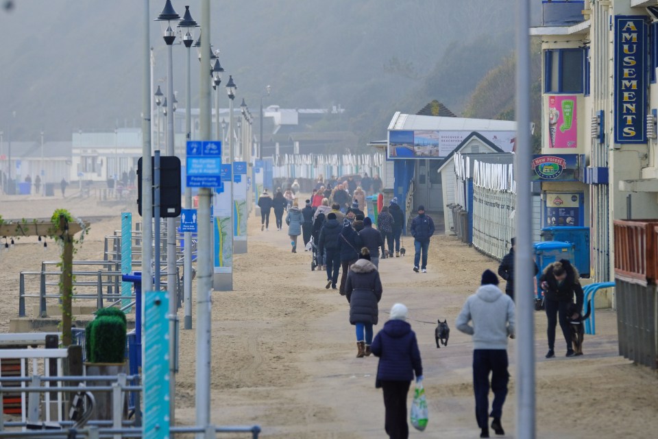 Locals enjoyed a morning walk on Bournemouth beach under the watchful eye of cops