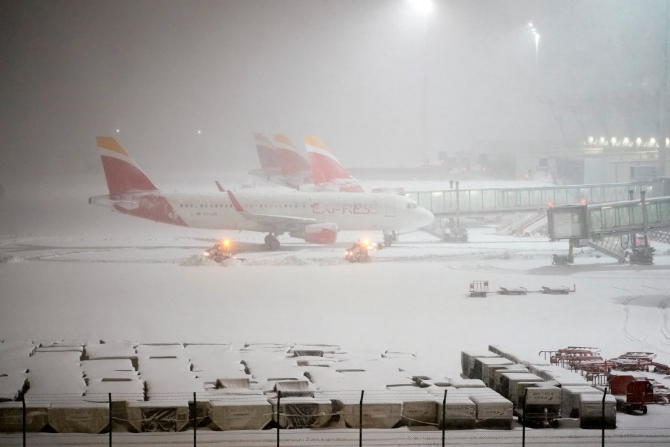 Planes parked at Adolfo Suarez Barajas airport amid the blizzard