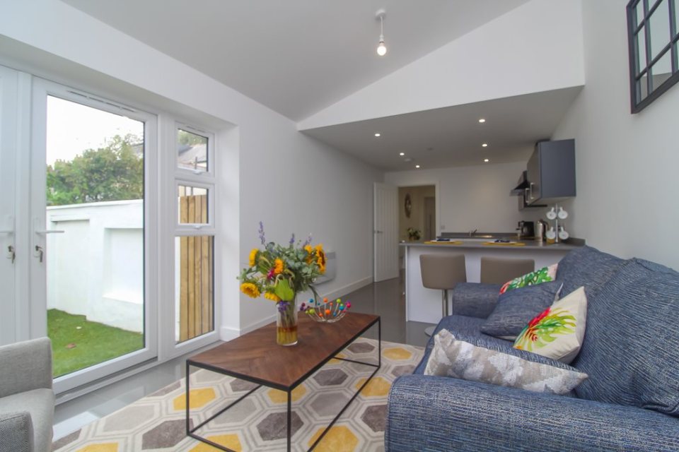The slim home comes complete with an open plan living room and kitchen