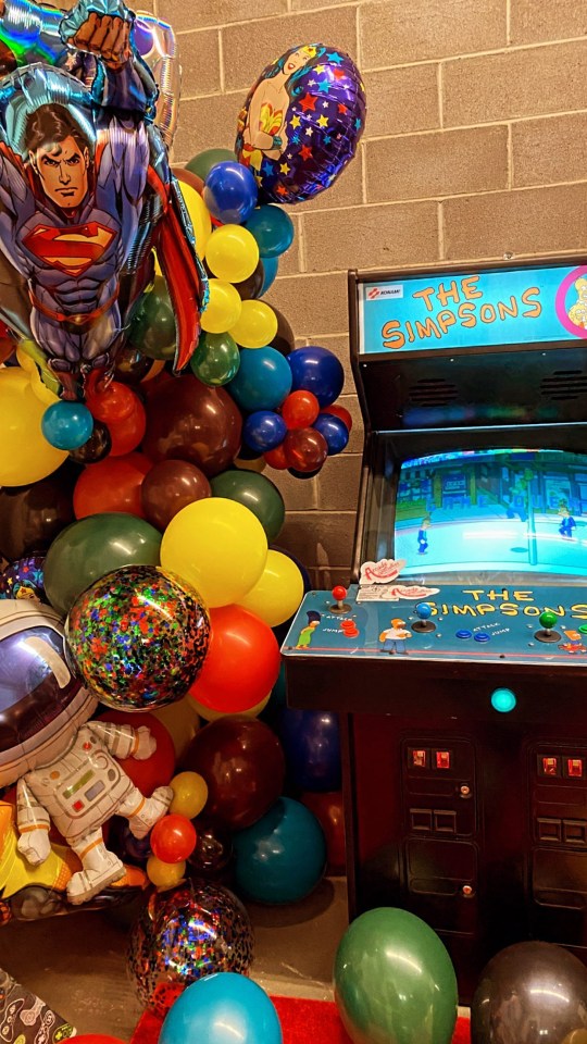 The superhero, alien and arcade game theme party took over the basement of their apartment