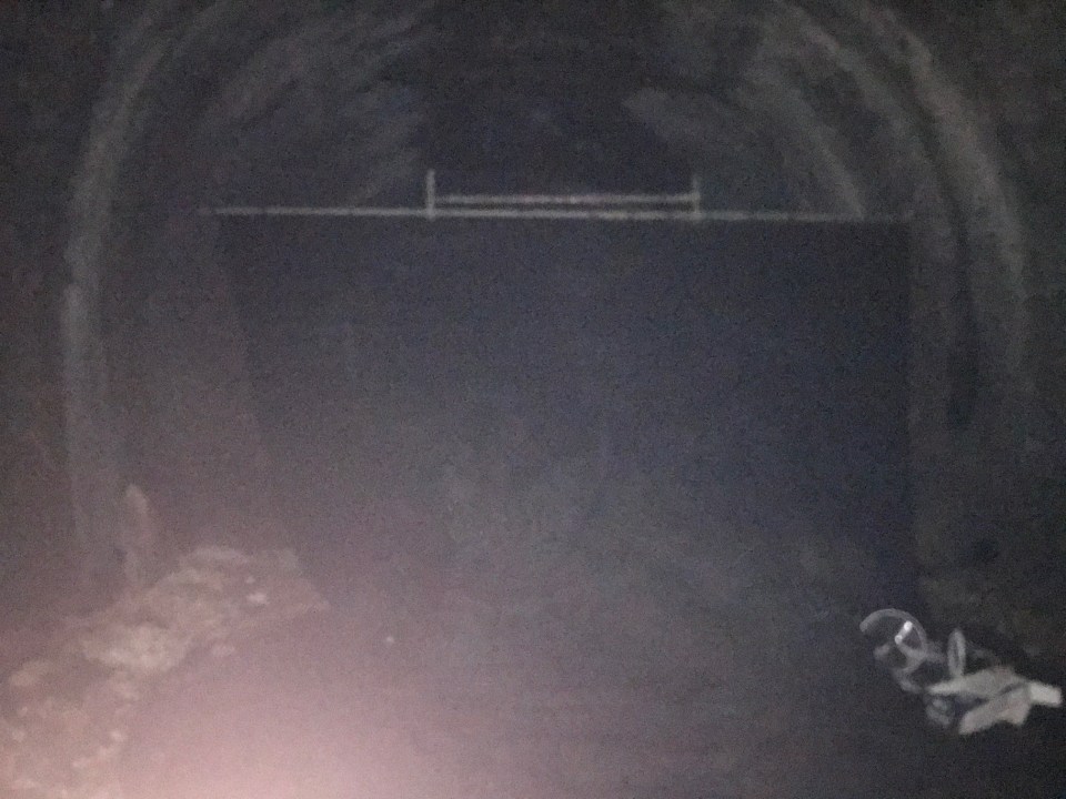 A large black curtain had been hung in the tunnel to hide the interior