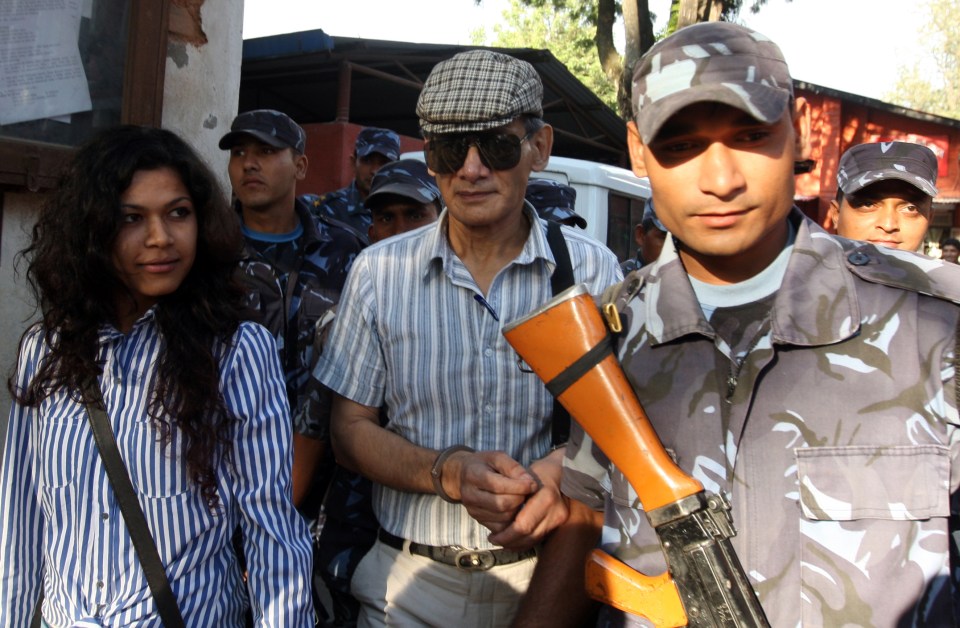 'The Serpent' Charles Sobhraj and his wife Nihita Biswas surrounded by armed men as they leave court in 2011