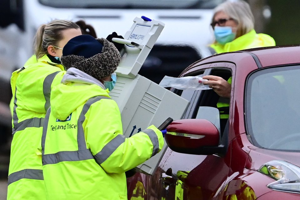 Members of the public being tested for Covid at a drive-in test centre in Goldsworth Park in Woking, Surrey