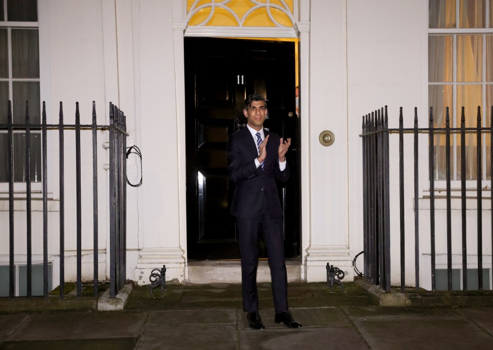 Chancellor Rishi Sunak claps outside No 11 Downing Street
