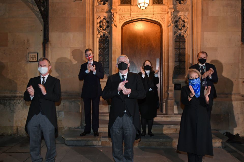 Sir Lindsay Hoyle, Speaker of the House of Commons, and members of the house take part in the clap 