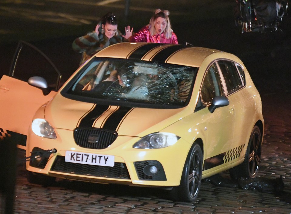 She's joined by two pals for the scene