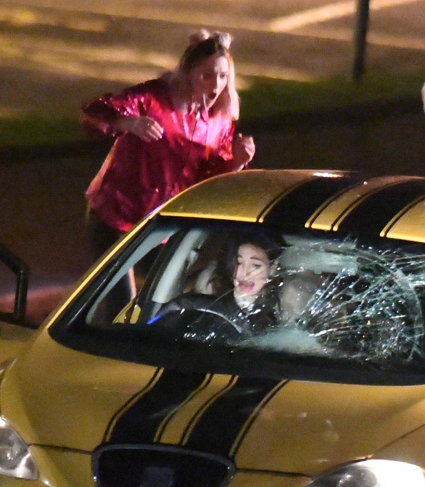 The actress' face contorts in panic
