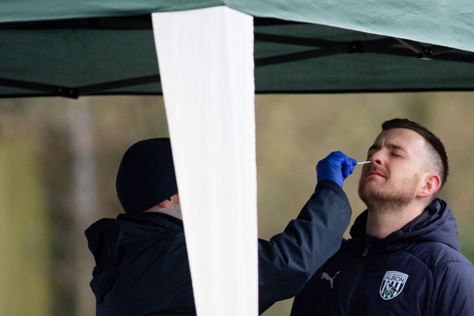 A member of the public is tested for Covid-19 at a mobile testing unit in Fernhill Heath, near Worcester