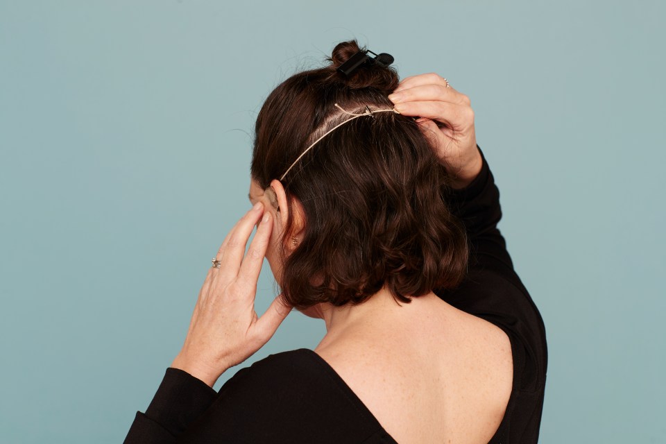 TIGHT FIT . . .  band is disguised under locks of hair