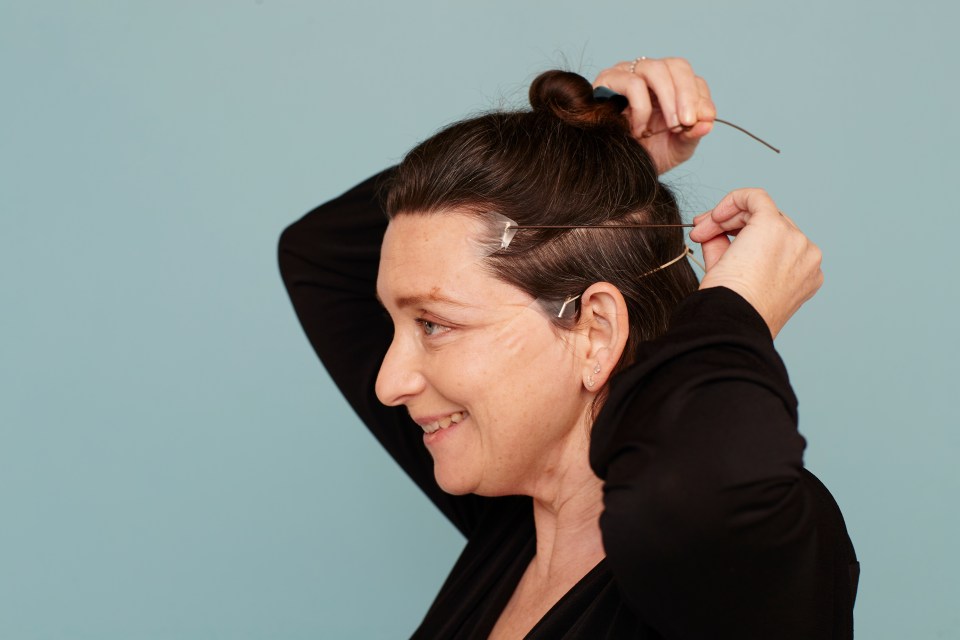 BROW FACTOR  . . . Vanessa tries ‘instant facelift’ tape on forehead