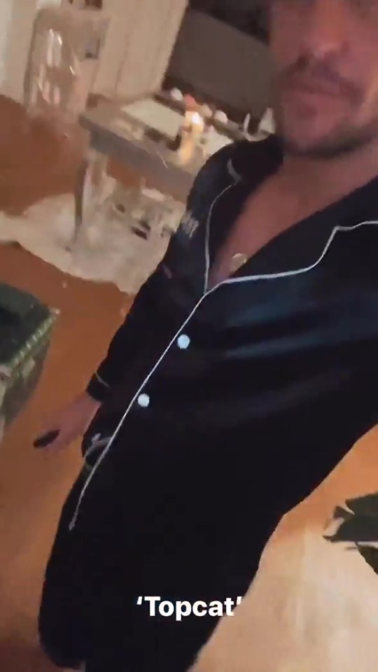 In another clip, he sported a pair of black silk pjs
