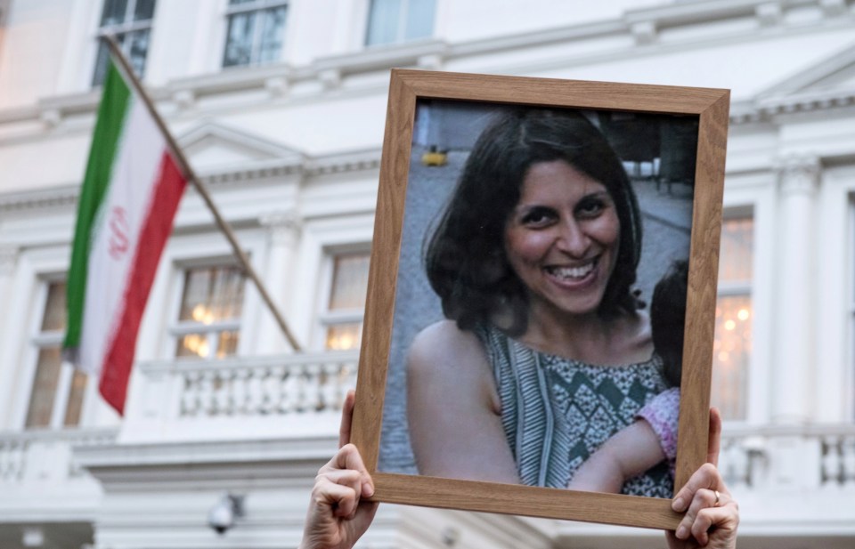 Supporters hold a photo of Nazanin Zaghari-Ratcliffe during a vigil for British-Iranian mother in 2017