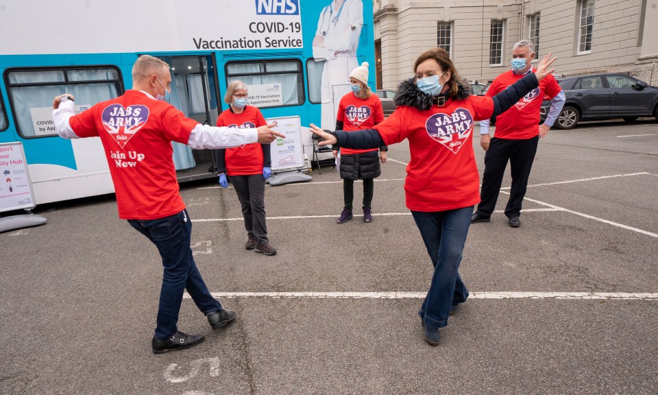 Robert dances with Jabs Army volunteers in Greenwich during lull in vaccinations