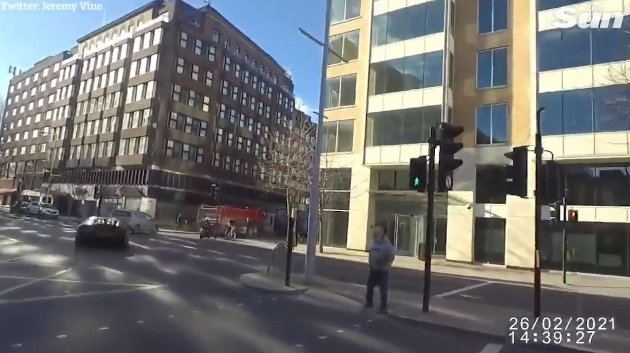 The car zoomed off after having gone through a red light before turning right