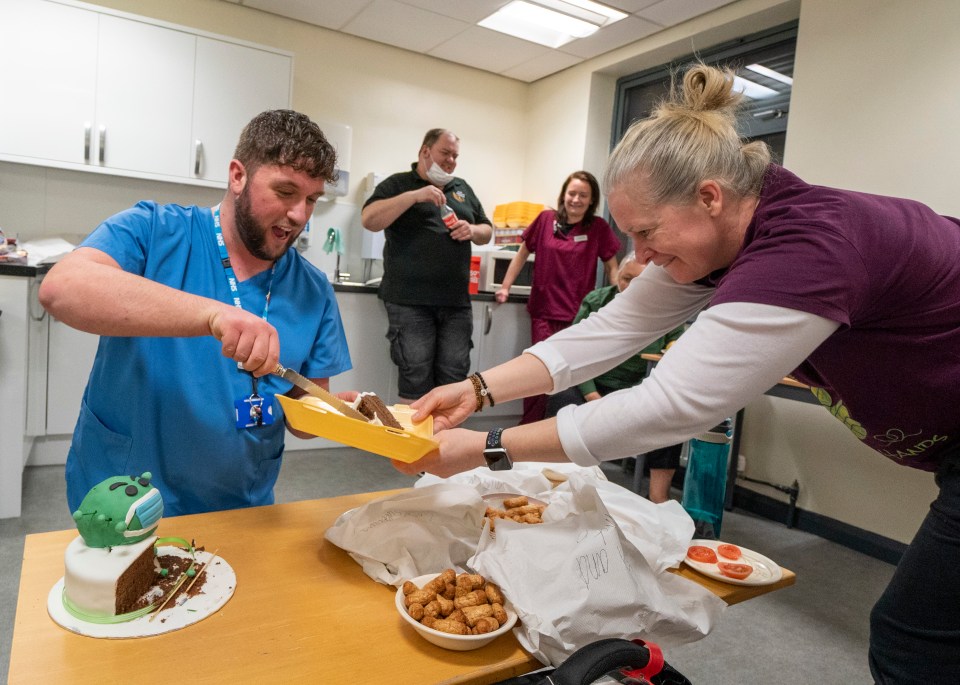After giving residents their second jab at a nearby care home, staff and volunteers were presented with a Covid-themed cake as a thank-you