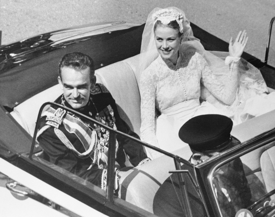 Grace Kelly waving to admirers while returning to the palace after wedding Prince Rainier in 1956