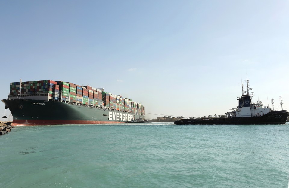 Rescue vessels work at the site of the stuck container ship Ever Given