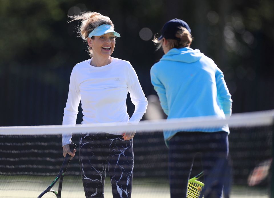 Two tennis players talk during a game of doubles at Grantham Tennis Club