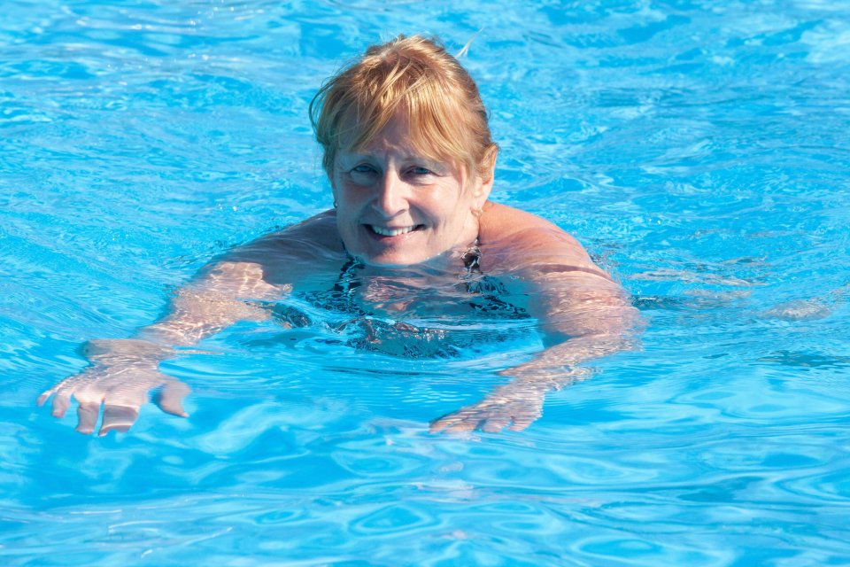 A woman cools off in Brockwell Lido, London