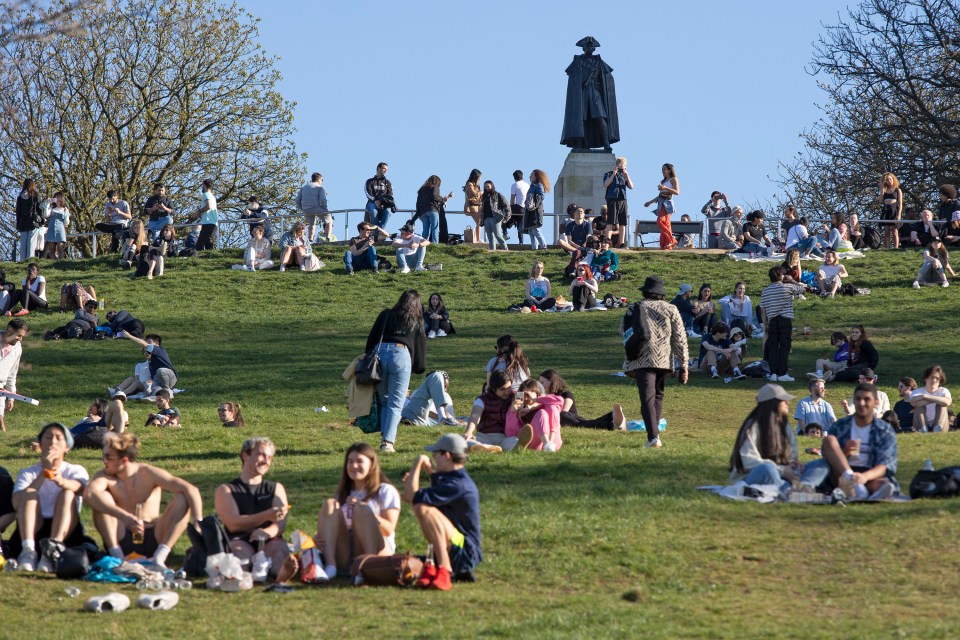 People flock to Greenwich Park to make the most of the fine weather