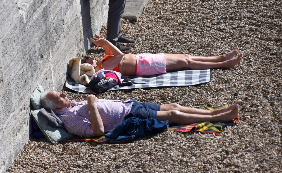 Sunseekers by the Hot Walls in Old Portsmouth, Hampshire,