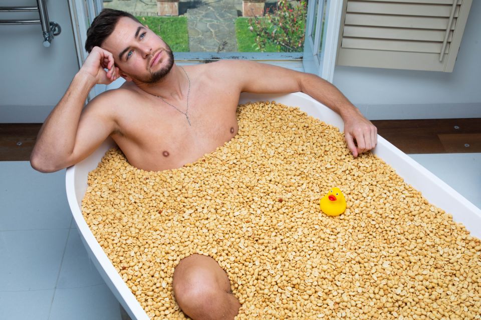 Chris Hughes poses in a bath filled with KP Nuts as he encourages men to ‘check their nuts’ ahead of April's testicular cancer awareness month. Self-examination can lead to early diagnosis, which in almost all cases, increase the chance of survival