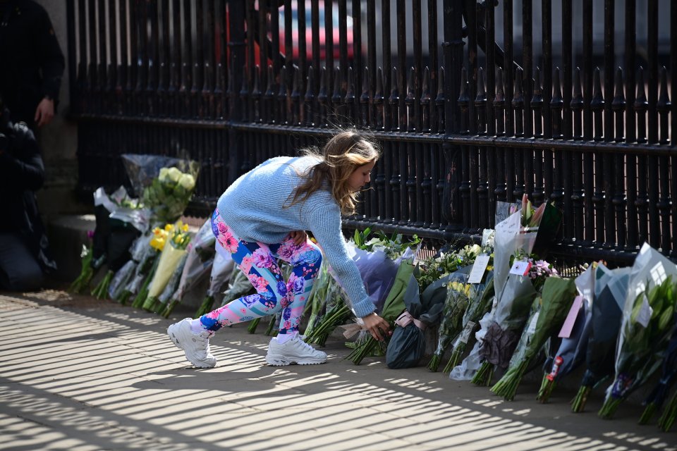 Flowers laid at the gates of Buckingham Palace