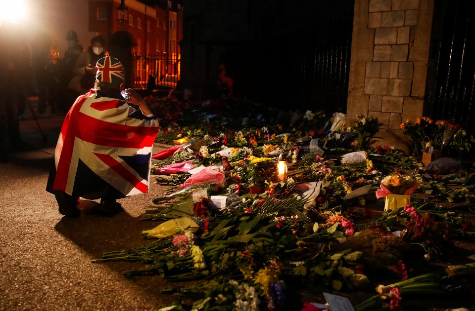 Mourners paying their respects yesterday evening