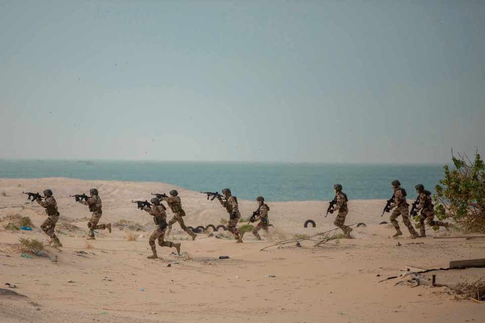 Members of the Republic of Guinea’s armed forces assault their objective during a simulated raid as part of the Flintlock Exercise in Nouakchott, Mauritania