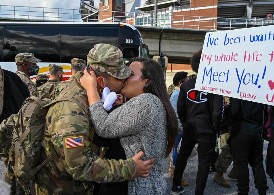 Members of the 729th Quartermaster Composite Supply Company, Maryland National Guard, are greeted after returning from their 11-month deployment on November 17, 2020