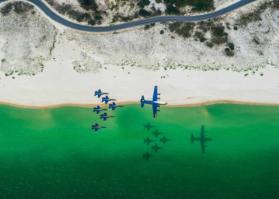 The US Navy Flight Demonstration Squadron, the Blue Angels, C-130 pilots and crew arrive at Naval Air Station Pensacola with the team’s new C-130J Super Hercules, alongside the Blue Angel delta formation