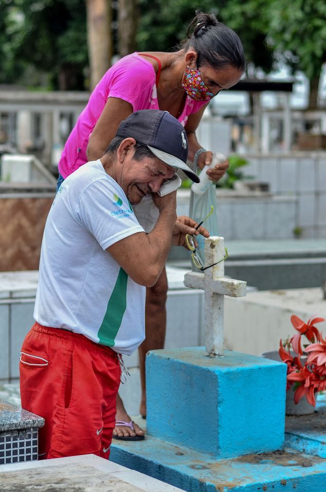 Relatives mourn a Covid victim at the municipal cemetery in Abaetetuba, Brazil, April 2021