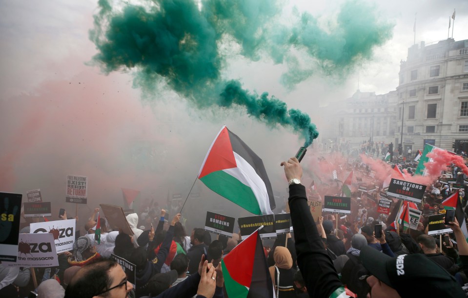 Protesters held banners, let off fireworks and chanted despite the heavy rain