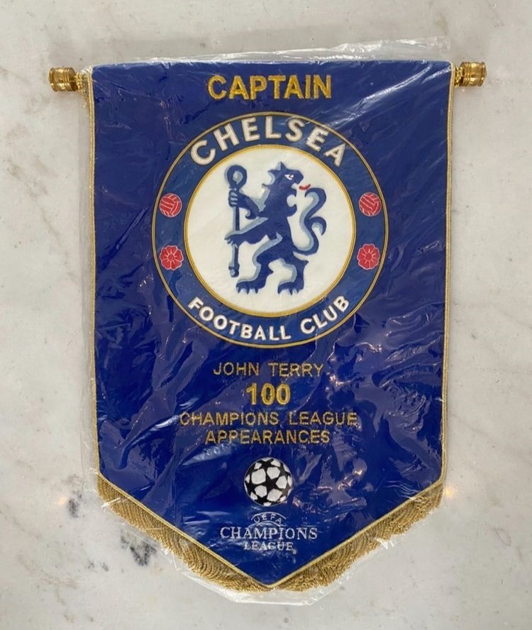 Terry showed of his commemorative pennant for his 100th Champions League match